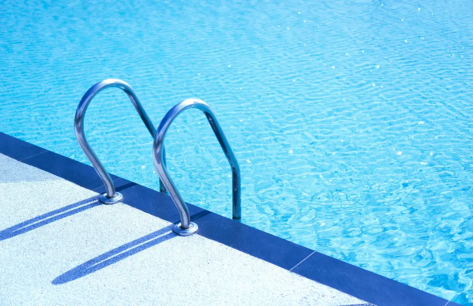 Outdoor pool ladder and details of the surrounding deck